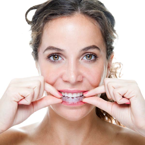 woman using clear retainer